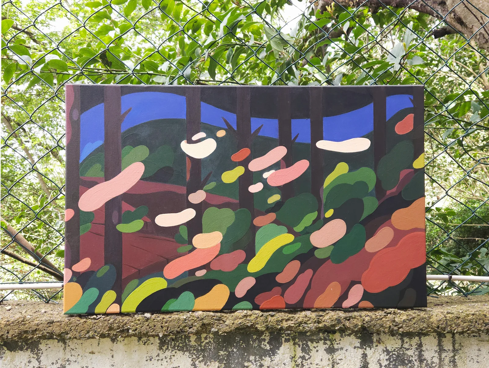 Dark Forest — acrylic painting of tree trunks and drifting leaf shapes in greens, oranges and pinks under a blue hill